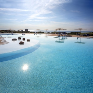Outdoor pool, open 8:30 AM to 7:00 PM, pool umbrellas, sun loungers