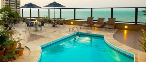 Outdoor pool, pool umbrellas, sun loungers