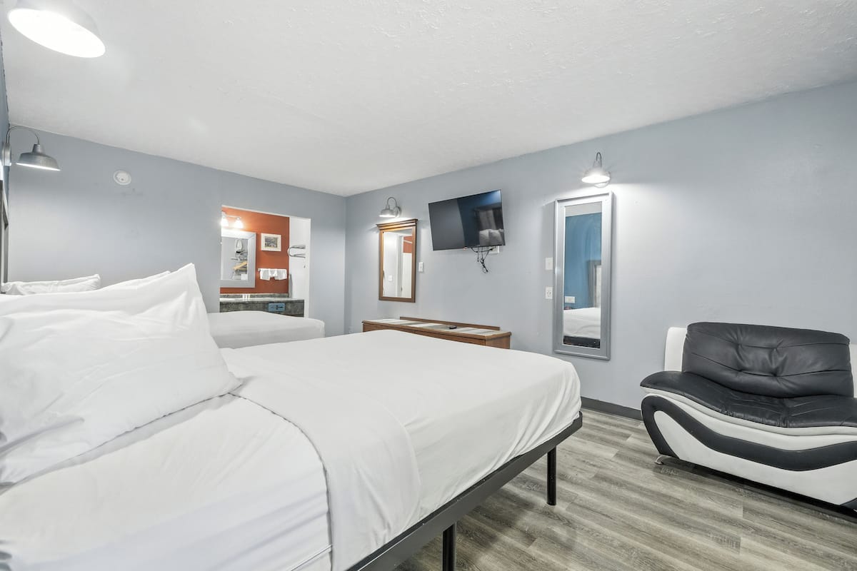 Suite, 2 Double Beds (1 Bedroom) | In-room safe, soundproofing, iron/ironing board, free cots/infant beds