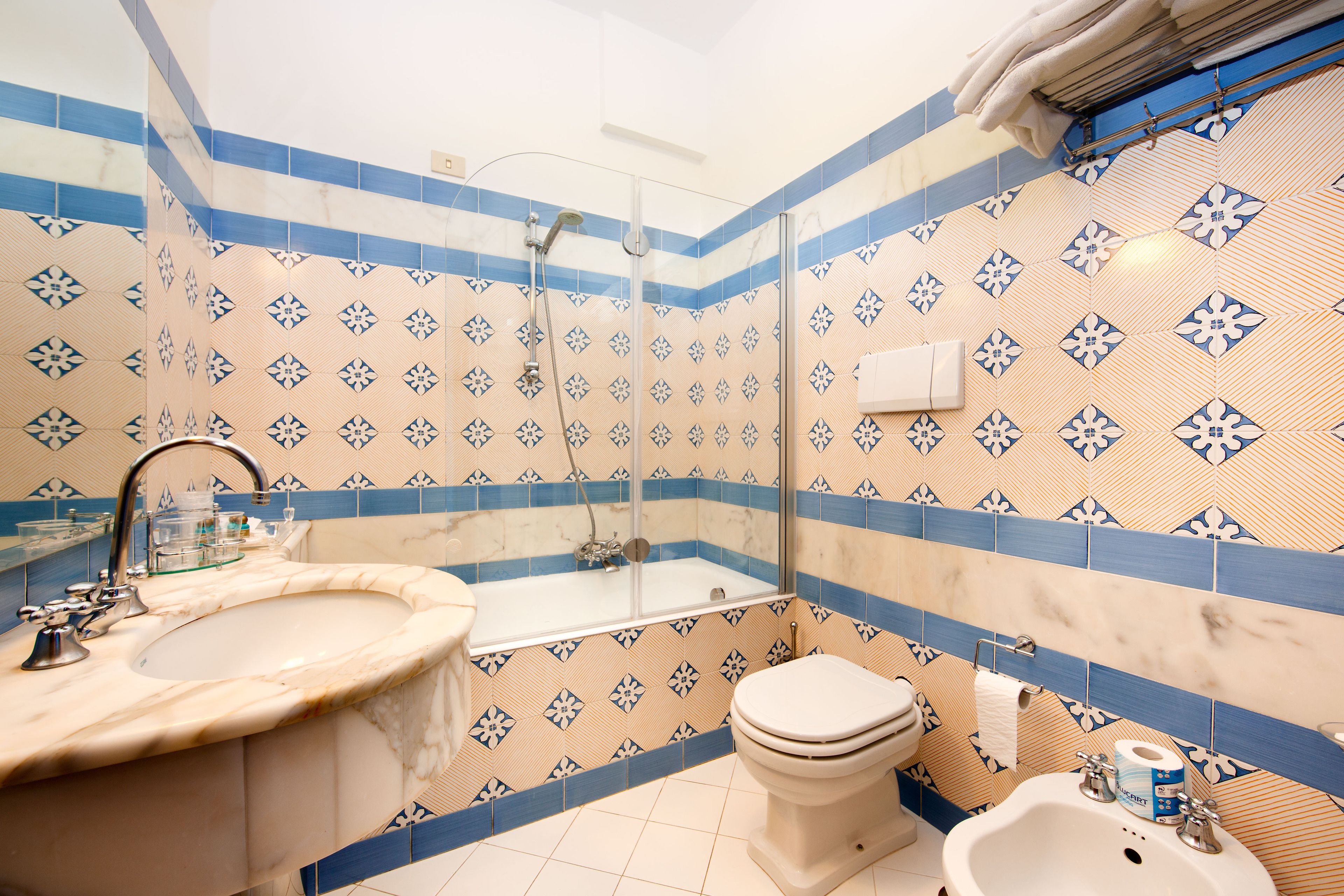 hair dryer, bathrobes, bidet, towels