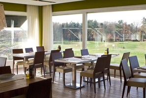 Breakfast, lunch, dinner served; golf course views