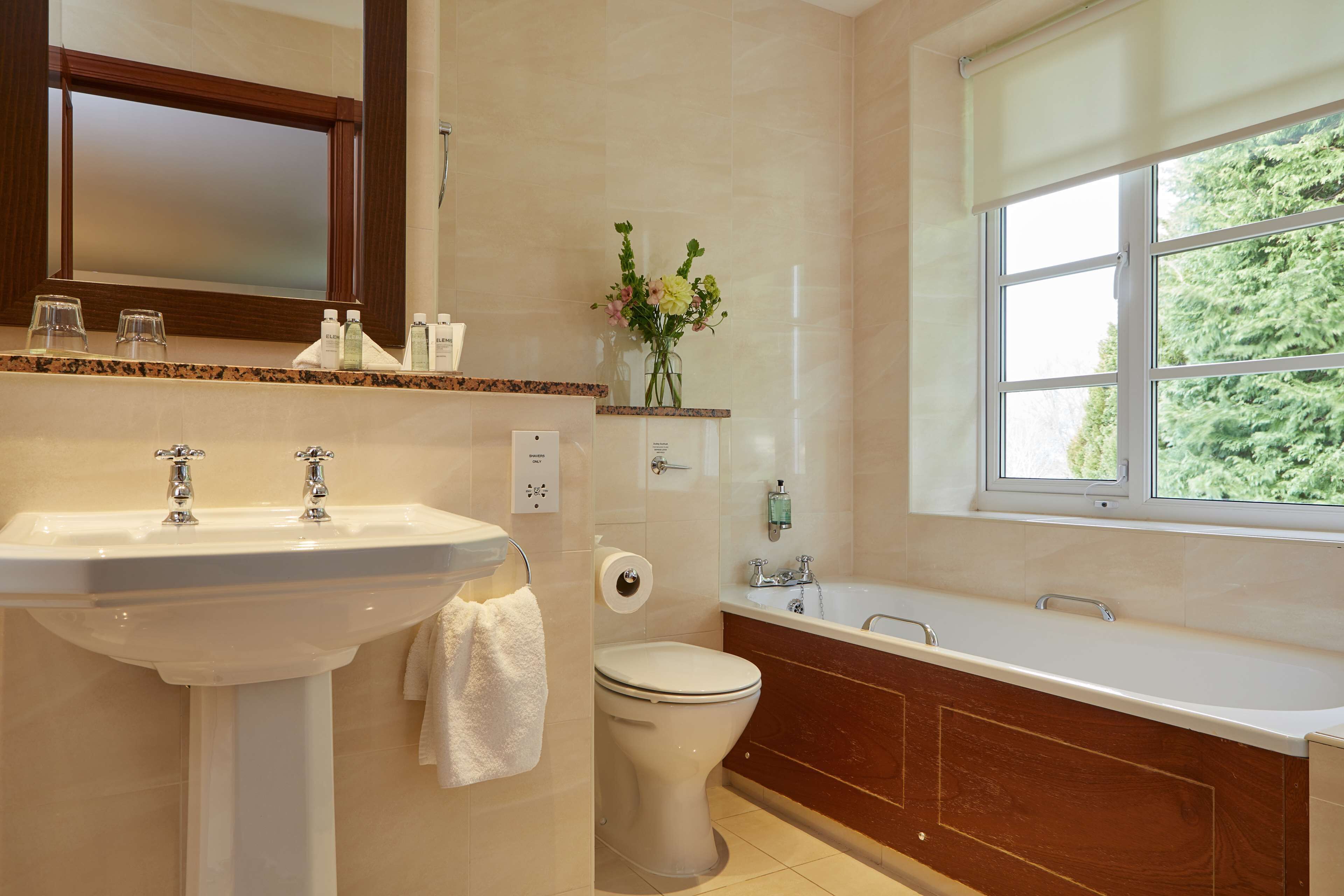 separate bathtub and shower, hair dryer, towels