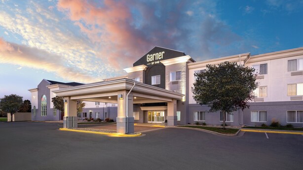 A hotel with a prominent 'Garner' sign, a covered entrance, and a landscaped driveway. - Garner Hotel Brookings by IHG (Brookings)