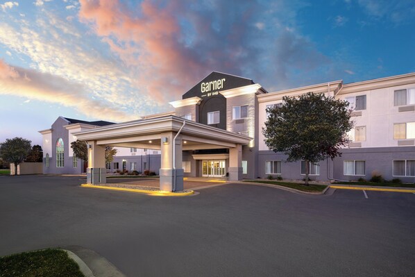 A hotel with a prominent 'Garner' sign, a covered entrance, and a landscaped driveway. - Garner Hotel Brookings by IHG (Brookings)