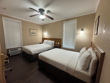 Traditional Room, 2 Full Beds | Iron/ironing board, free WiFi, bed sheets. District Hotel