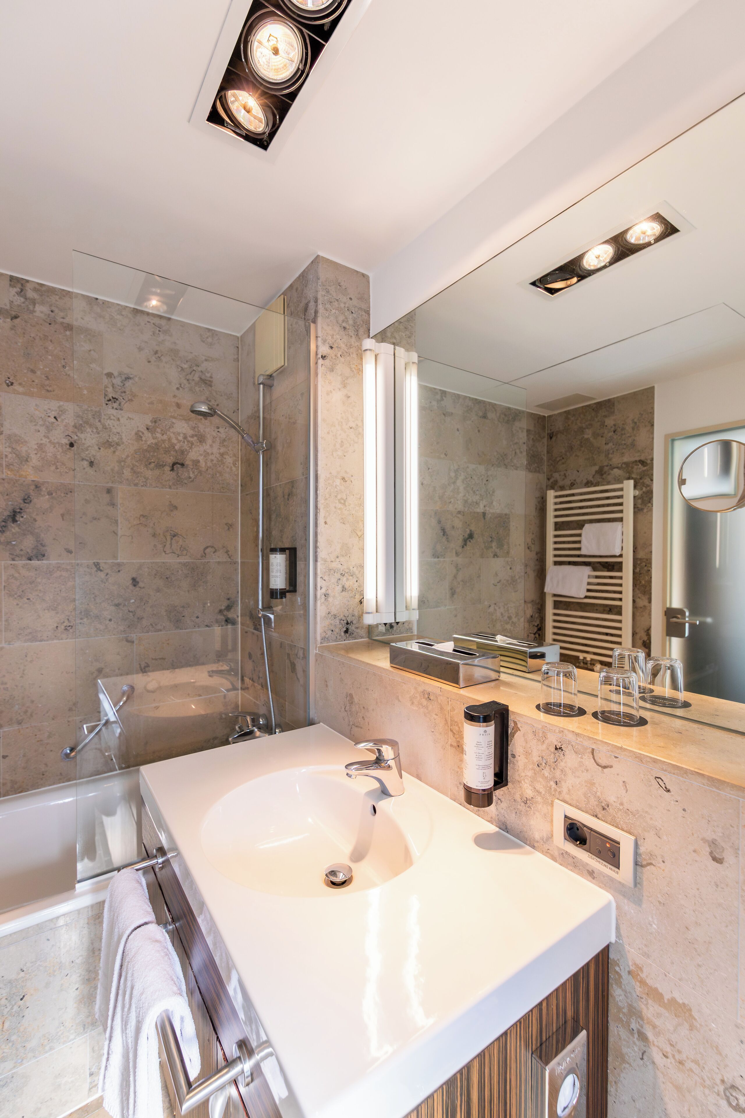 eco-friendly toiletries, hair dryer, towels, soap