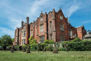 A large, historic brick building with multiple chimneys and a symmetrical facade. - De Vere Latimer Estate (Chesham)