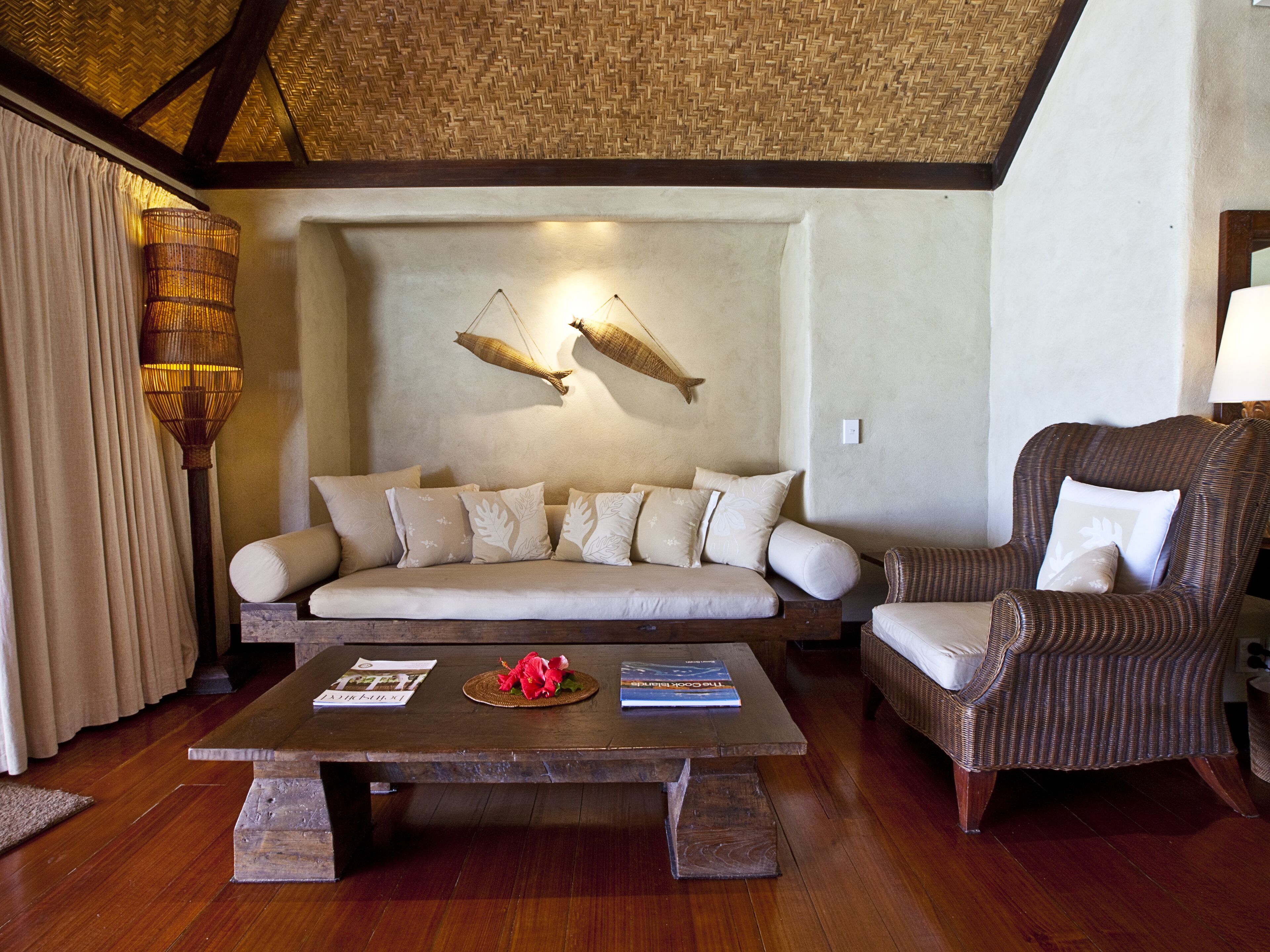 A cozy living room with a sofa, armchair, and coffee table.