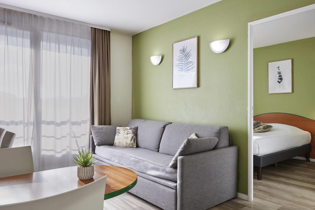 Apartment, 1 Bedroom (4 people) | Blackout drapes, iron/ironing board, free cribs/infant beds, free WiFi