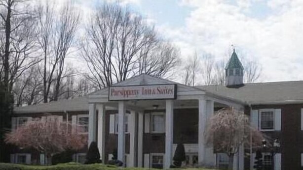 A building with a sign reading "Parrington Inn & Suites". - Parsippany Inn and Suites Morris Plains (Morris Plains)