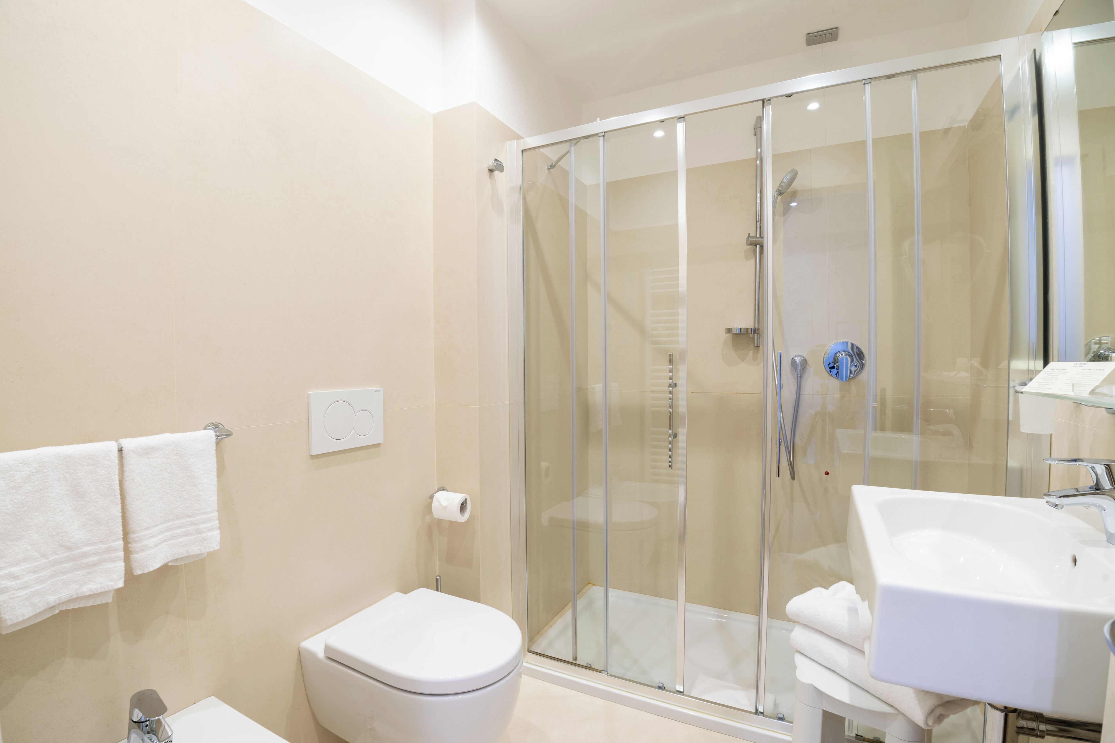 suite | bathroom | rainfall showerhead, hair dryer, bidet, towels