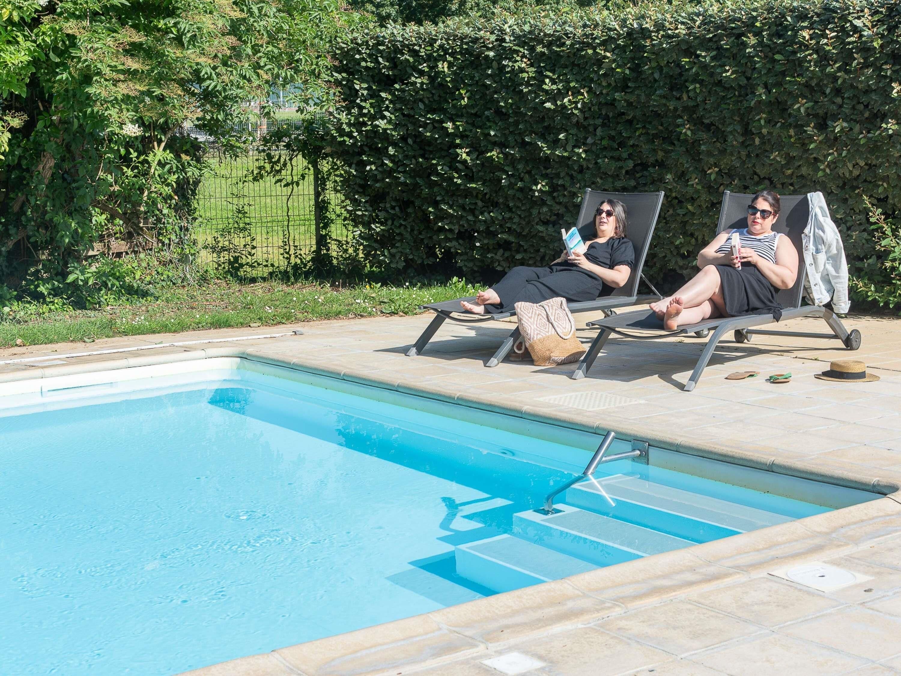 Seasonal outdoor pool, open 7:00 AM to 9:00 PM, pool loungers