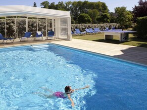 Seasonal outdoor pool, pool loungers