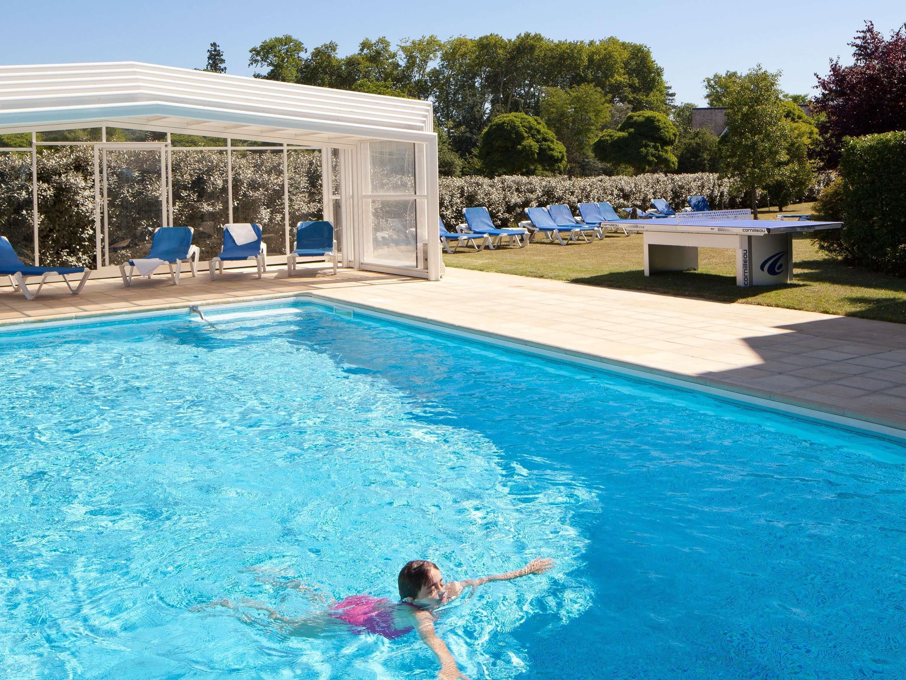 Seasonal outdoor pool, open 7:00 AM to 9:00 PM, pool loungers
