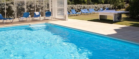 Seasonal outdoor pool, open 7:00 AM to 9:00 PM, sun loungers