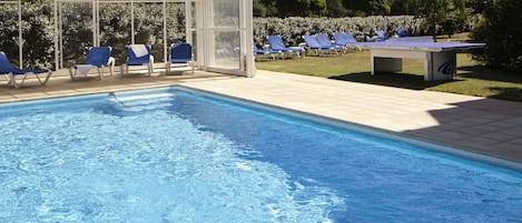 Seasonal outdoor pool, pool loungers