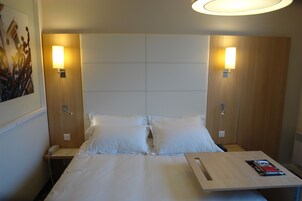 Desk, blackout drapes, soundproofing, free cribs/infant beds