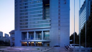 A modern hotel building with multiple floors and a prominent entrance. - Park Plaza Beijing Science Park (Beijing)