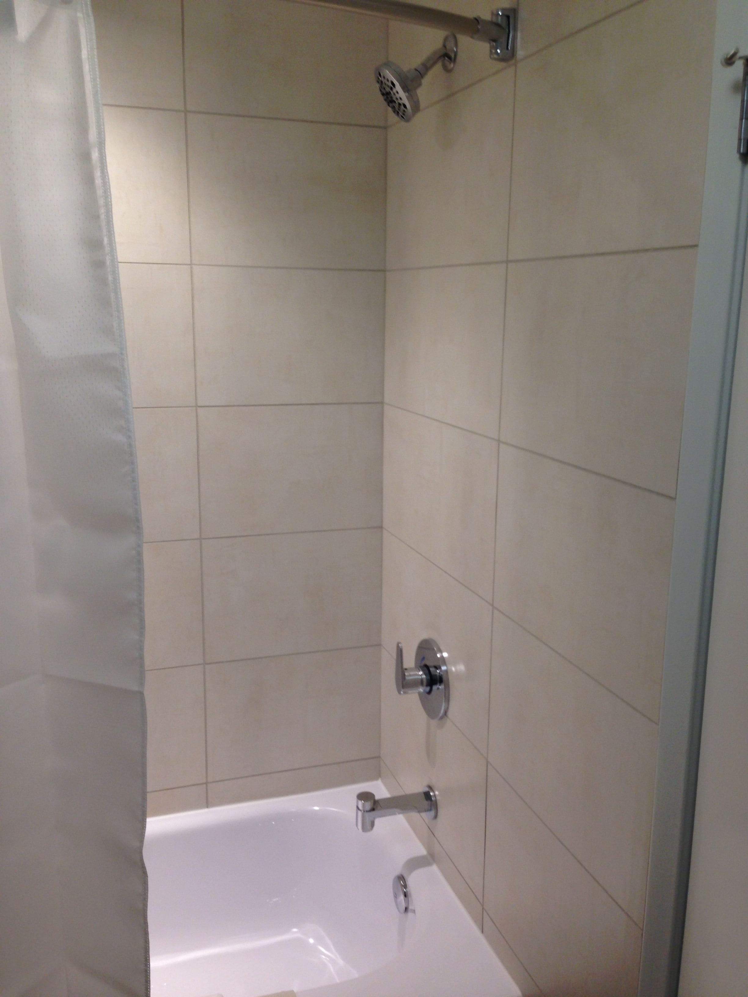 shower, designer toiletries, hair dryer, towels