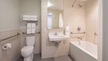 A bathroom with a toilet, sink, and bathtub.
