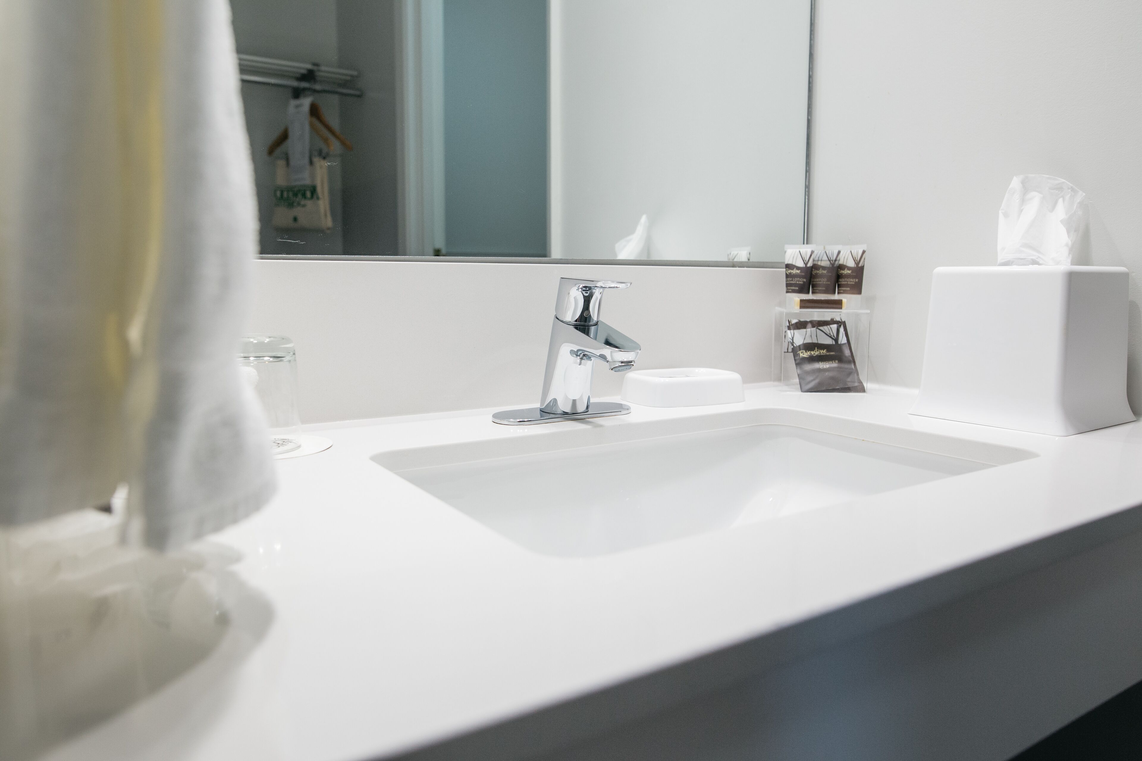 shower, designer toiletries, hair dryer, towels