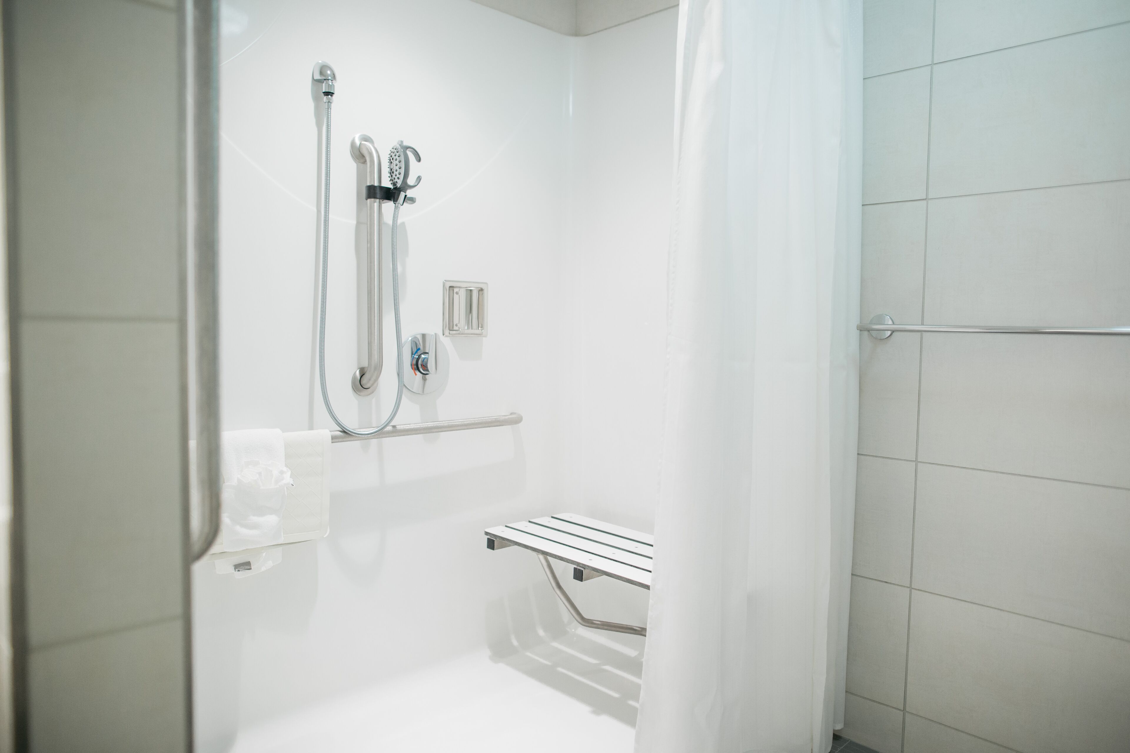 shower, designer toiletries, hair dryer, towels