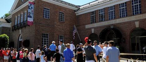 A brick building with a sign reading 'National Baseball Hall of Fame and Museum.'