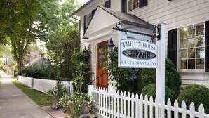 A white house with a sign reading "The 1770 House Restaurant & Inn."