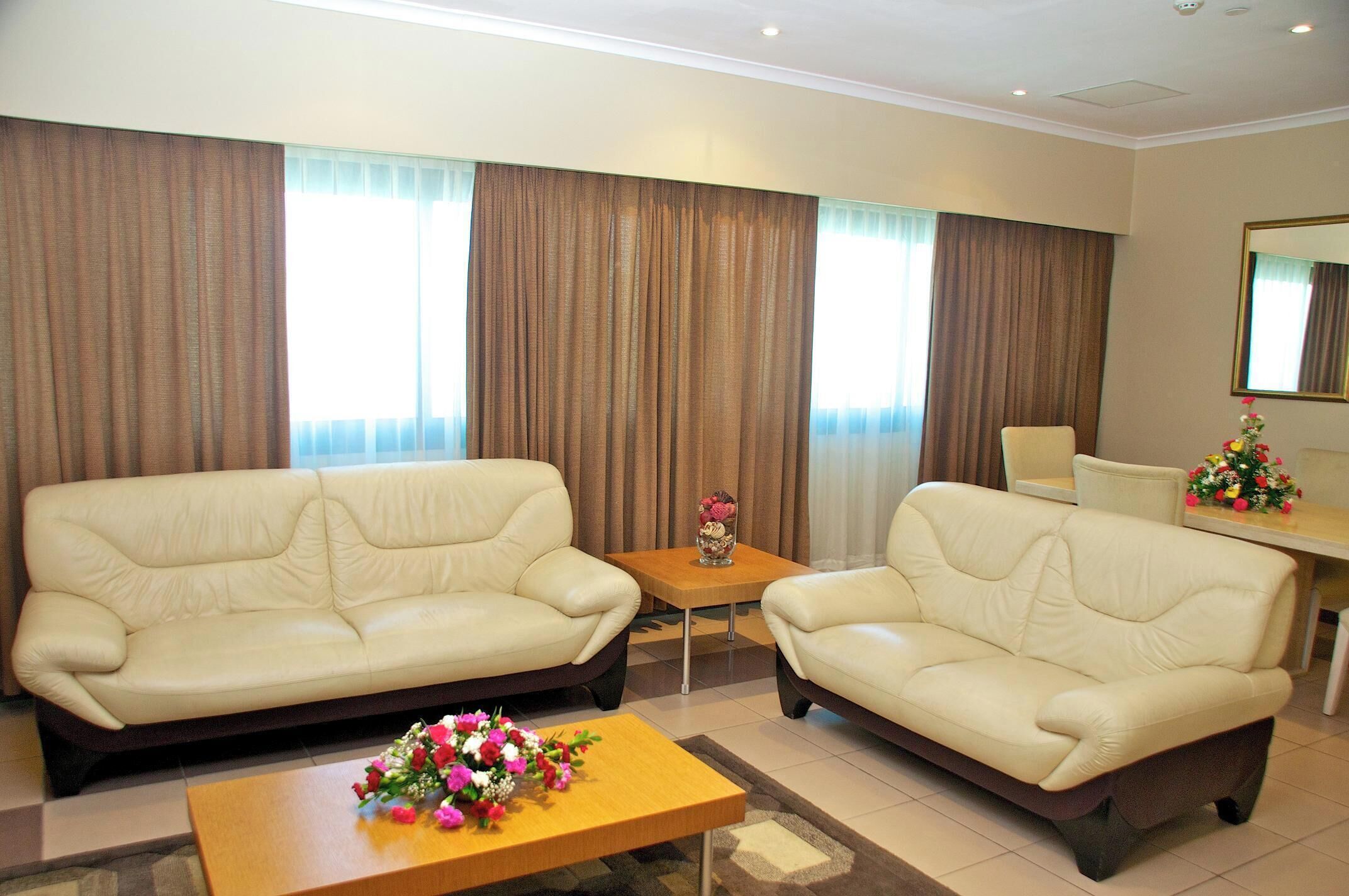 Executive Suite | Living area | 40-inch flat-screen TV with satellite channels, TV