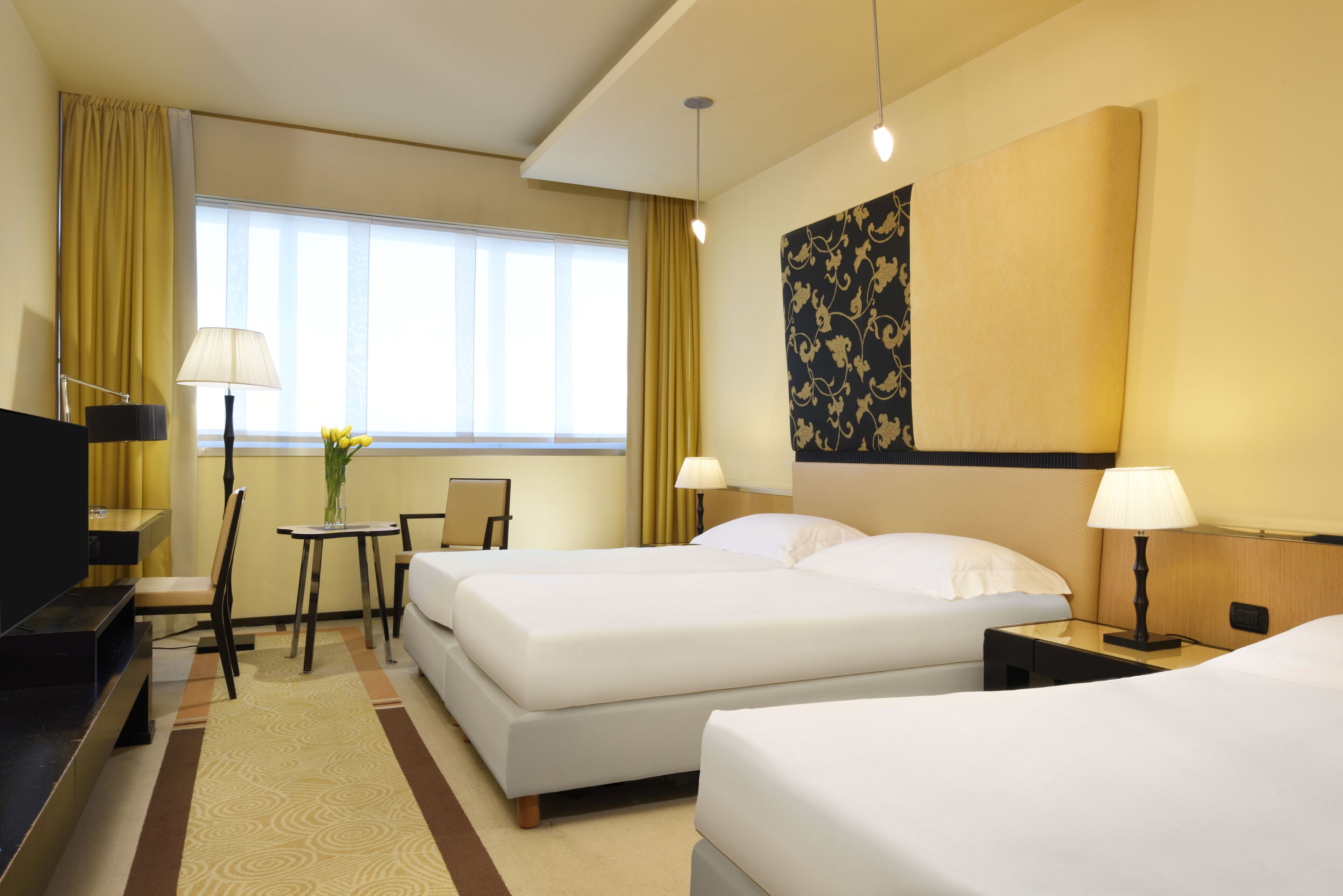 premium bedding, down duvets, tempur-pedic beds, minibar