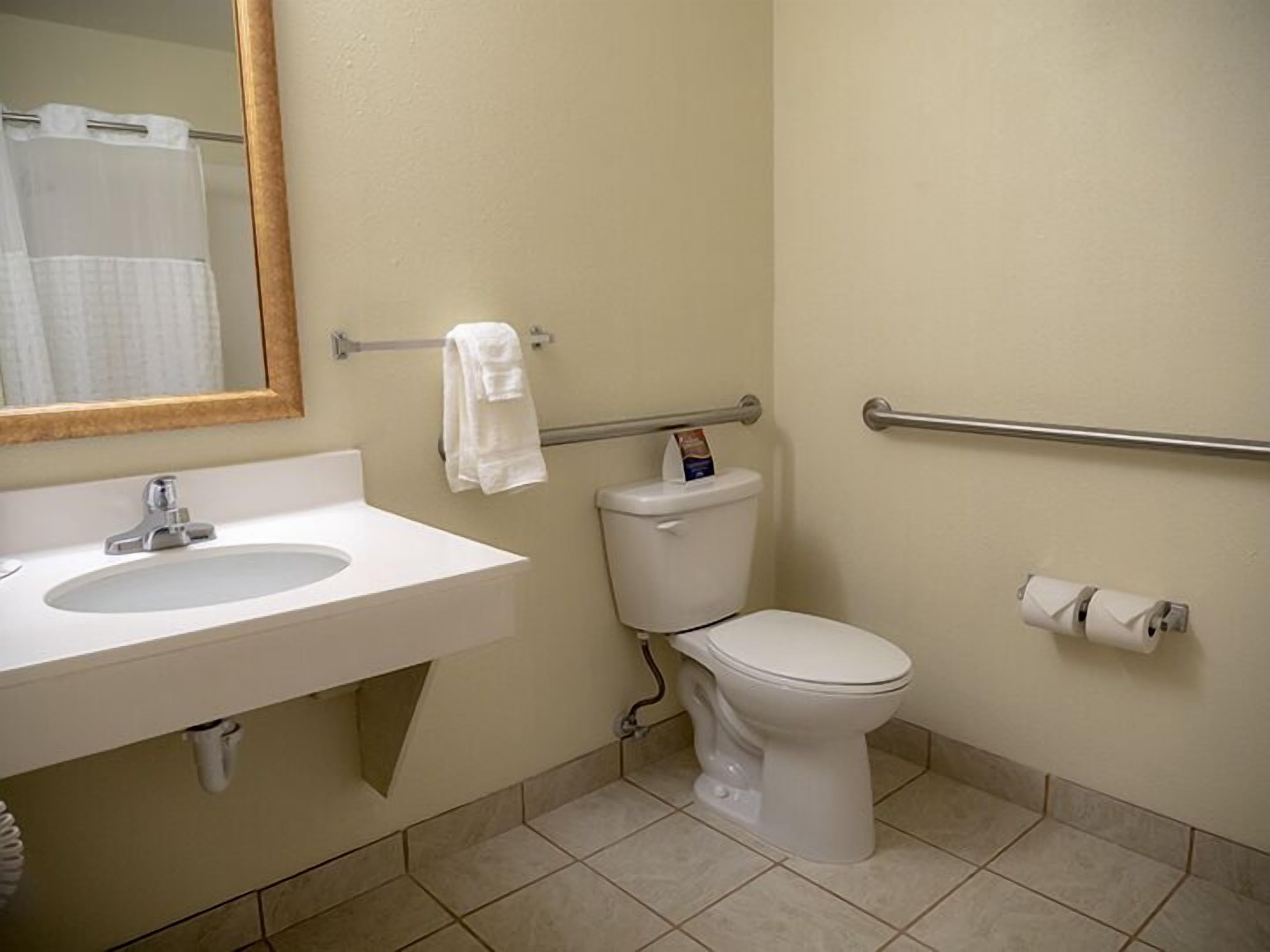 designer toiletries, hair dryer, towels