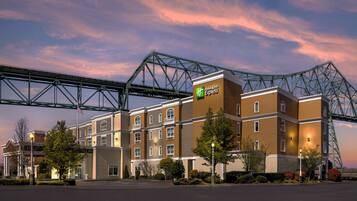 A Holiday Inn Express hotel with a modern design, featuring multiple floors and a prominent entrance.