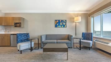 Desk, laptop workspace, iron/ironing board, free cribs/infant beds