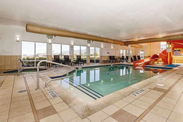 Indoor pool, open 8:00 AM to 10:00 PM, pool loungers