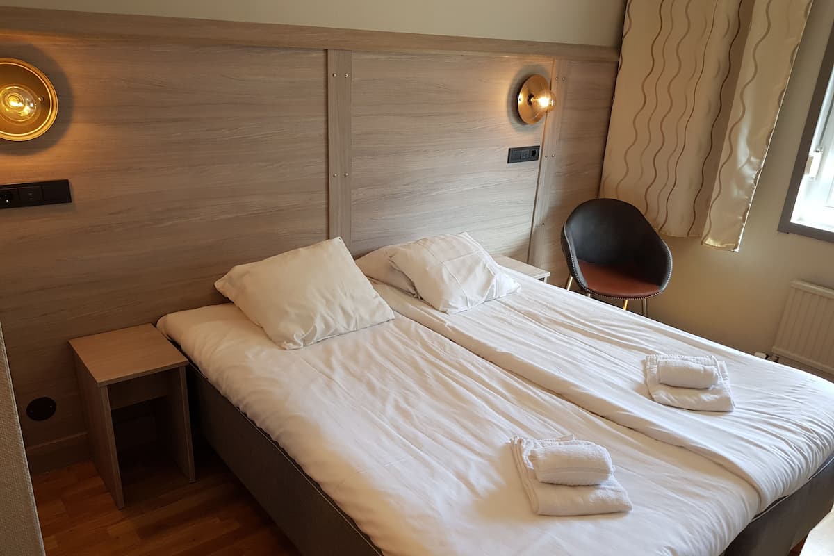 Double Room, Private Bathroom | Minibar, desk, laptop workspace, blackout curtains