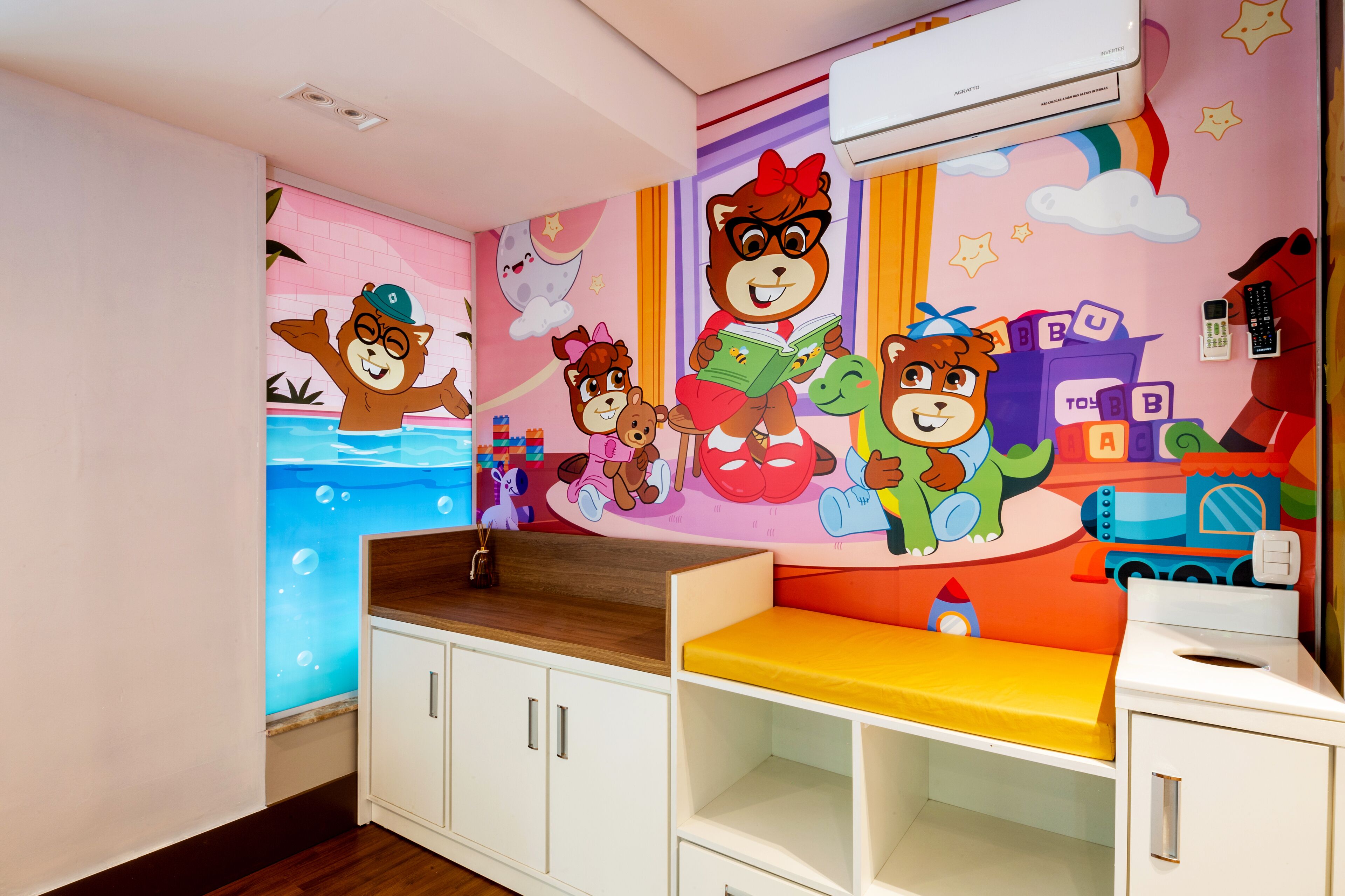 A child's playroom with a colorful mural, a wooden shelf, and a small bed.