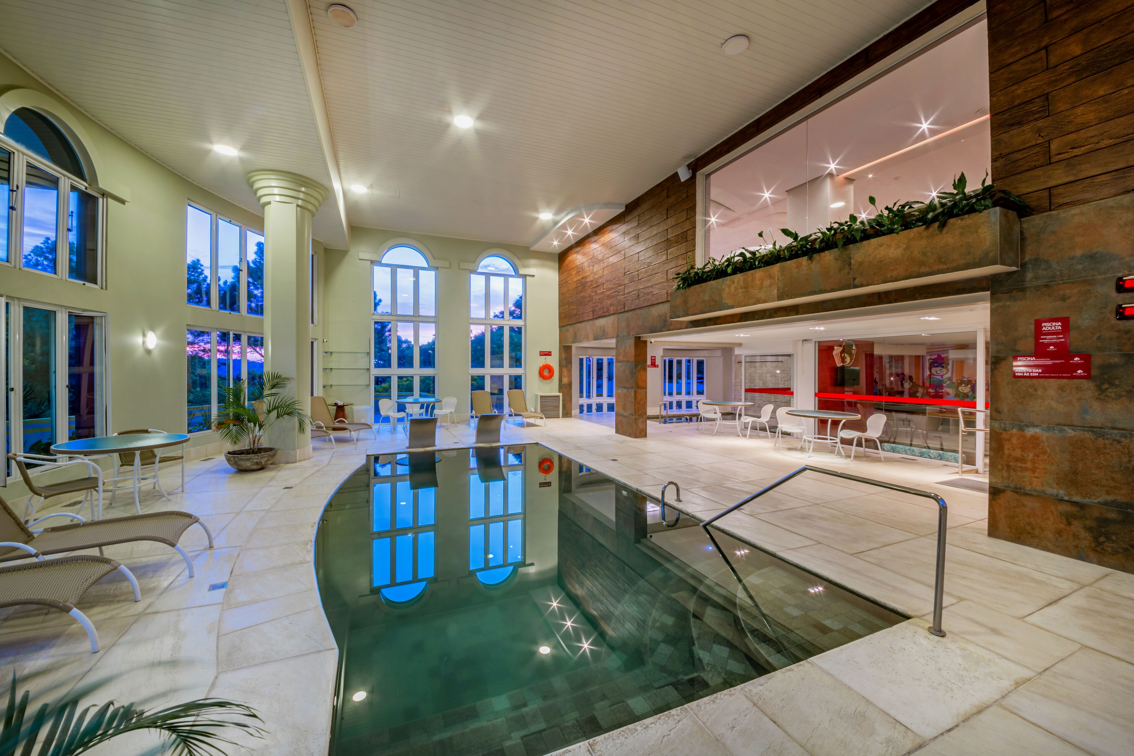 Indoor pool, open 10:00 AM to 10:00 PM, pool loungers