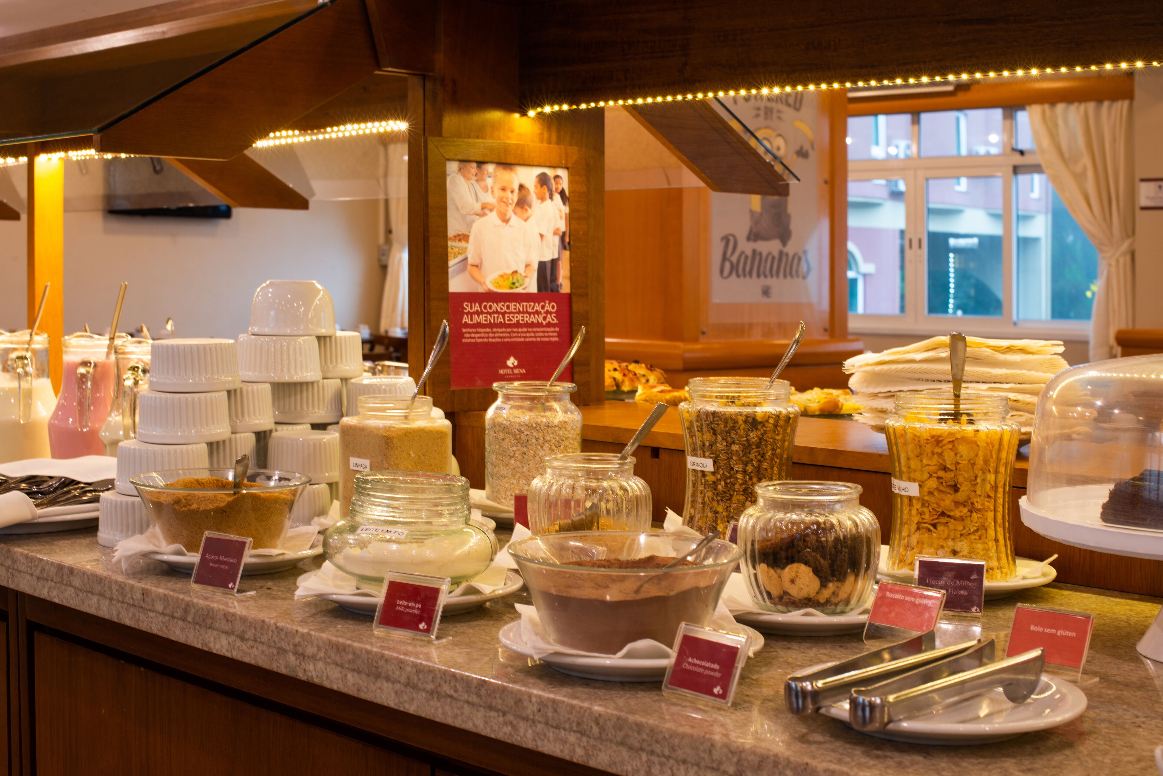 A buffet with various food items and serving utensils.