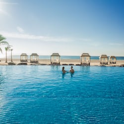 4 outdoor pools, a heated pool, cabanas (surcharge), pool umbrellas