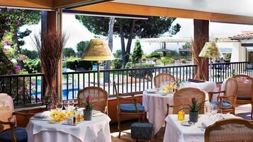 Breakfast, lunch, dinner served; pool views