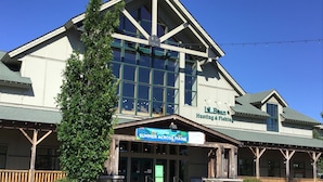 A building with a sign for 'L.L. Bean Hunting & Fishing' and 'Summer Across Maine'. - Fairfield Inn & Suites by Marriott Brunswick Freeport (Brunswick)