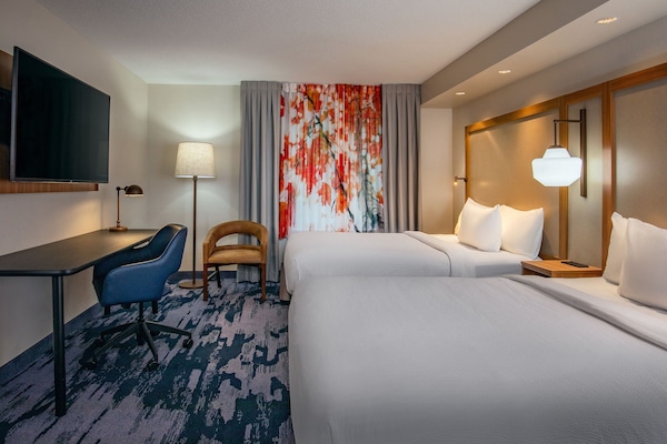 Premium bedding, desk, laptop workspace, blackout drapes