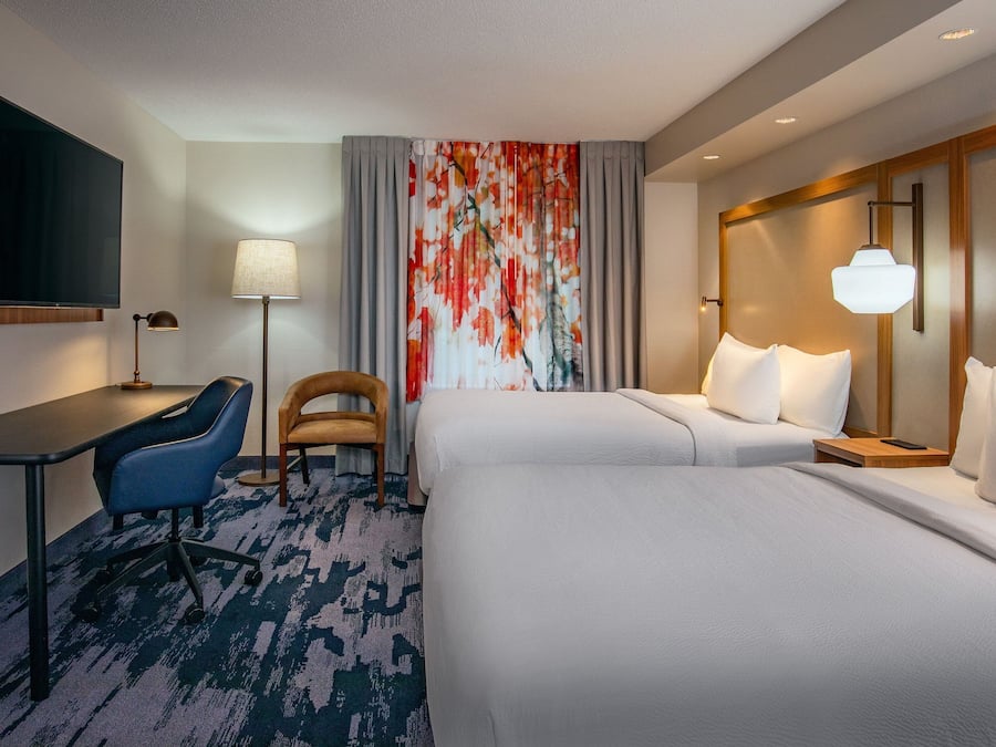 Premium bedding, desk, laptop workspace, blackout curtains