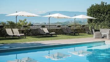 Seasonal outdoor pool, pool umbrellas, pool loungers