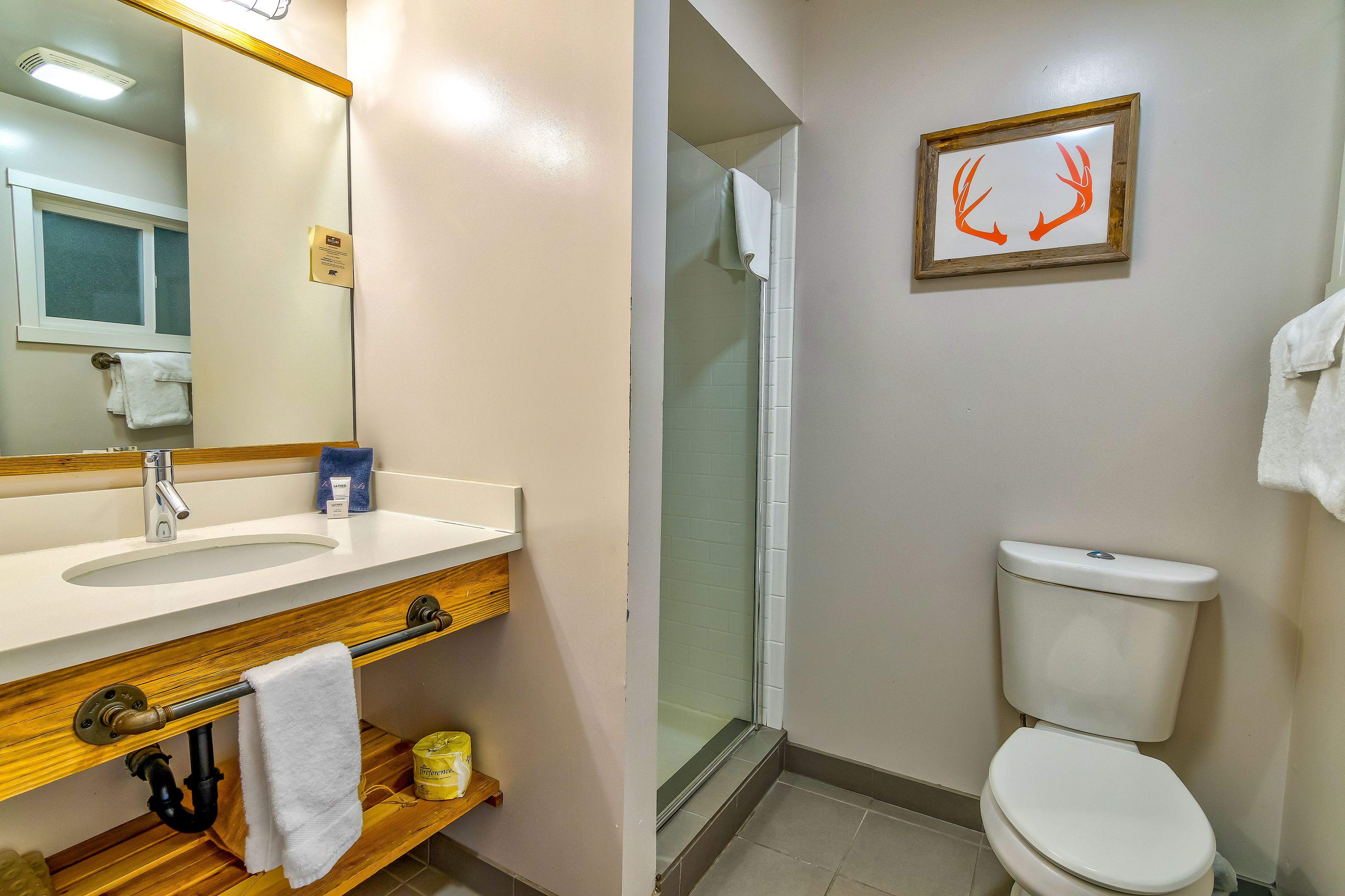 shower, designer toiletries, hair dryer, towels