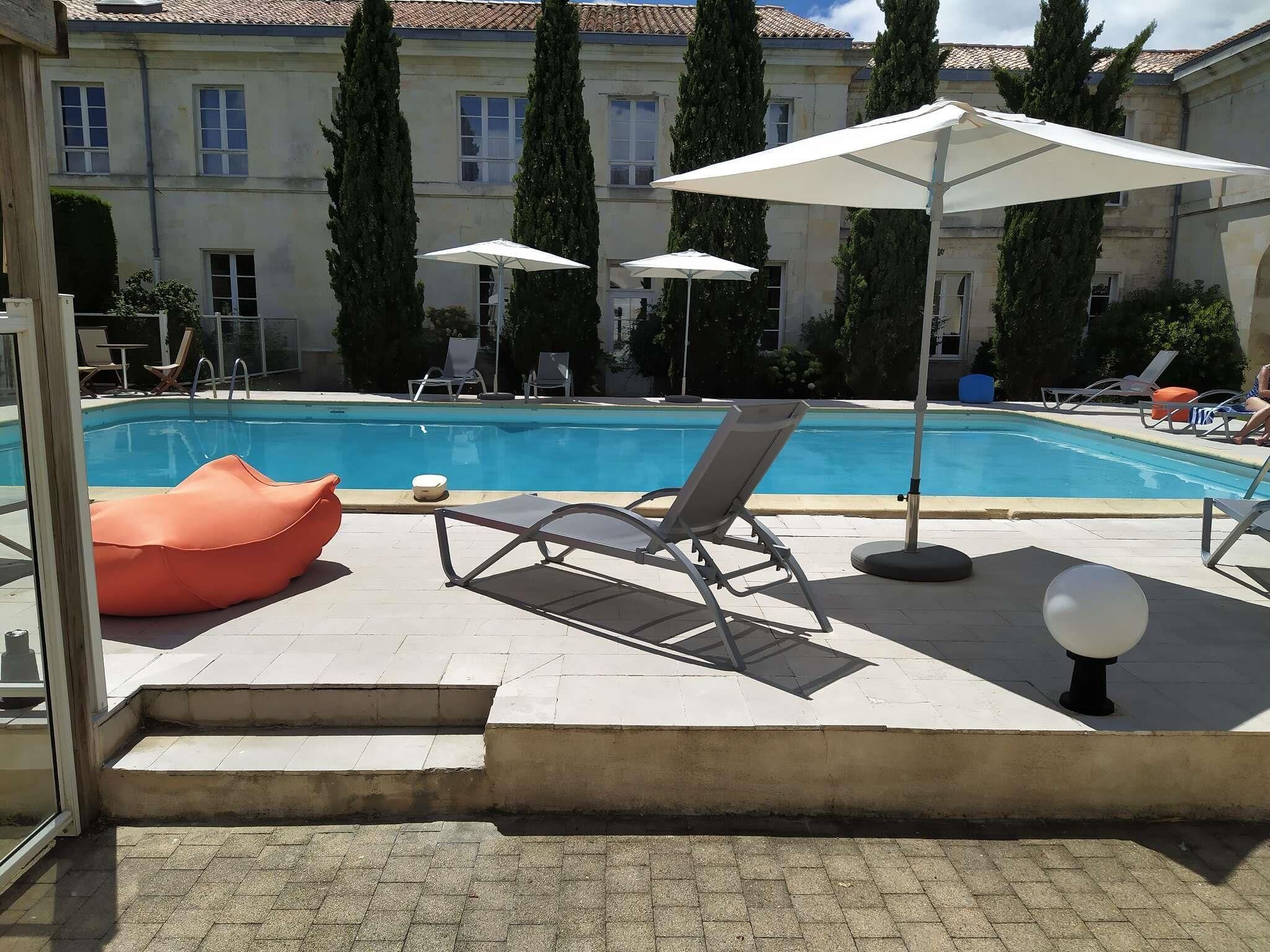 Seasonal outdoor pool, pool umbrellas, pool loungers