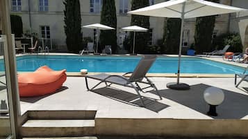 Seasonal outdoor pool, pool umbrellas, pool loungers
