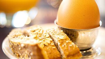 A breakfast setting with a plate of toast and a cup of coffee.
