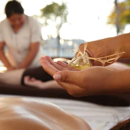 A massage therapy session with a person receiving a treatment.