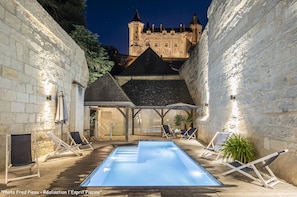 Outdoor pool, open 9:00 AM to 9:00 PM, pool umbrellas, pool loungers